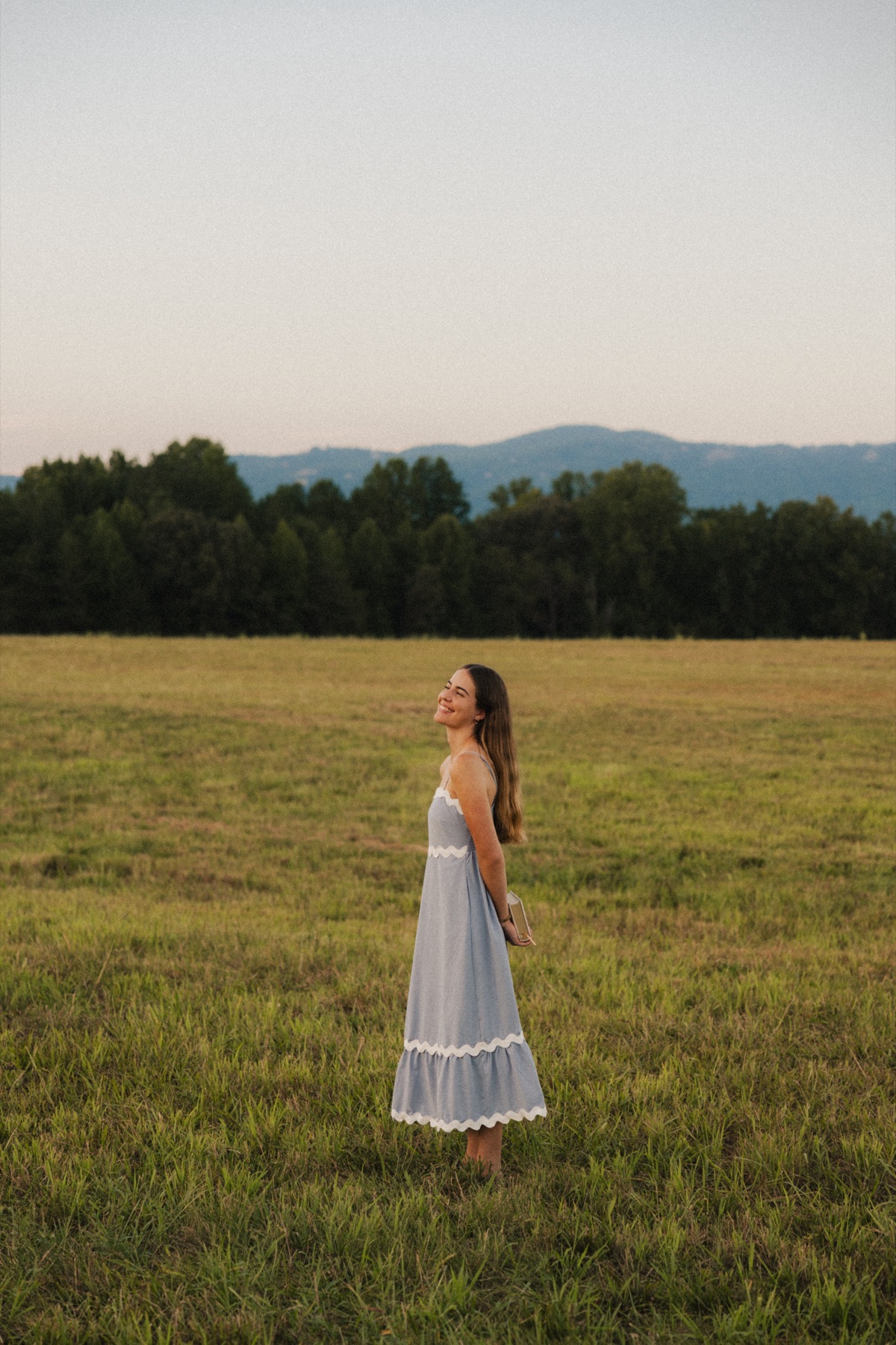 Carlien Pottas standing in a field at dusk
